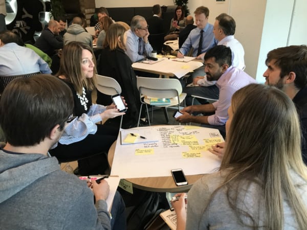 People working a table together