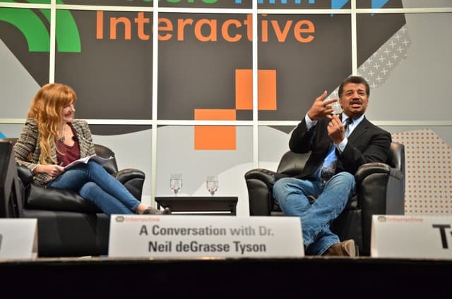 Christie interviewing Neil deGrasse Tyson at SXSW in 2014.