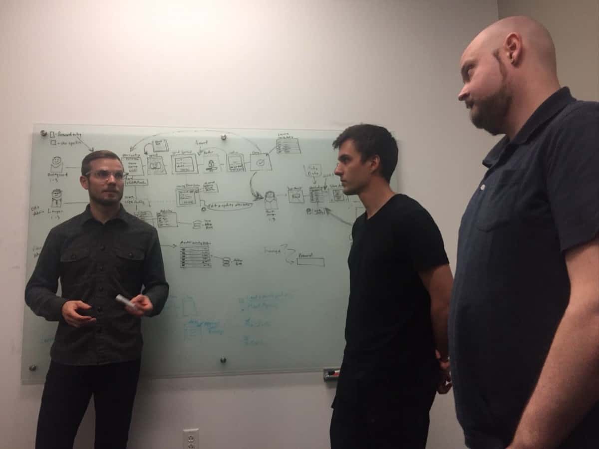 John working with a team