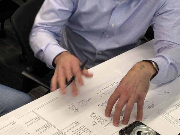 Man working through a sketch