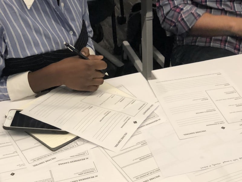 People working on data worksheets