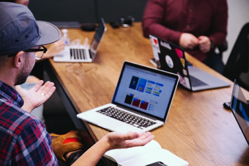 Team working at table with laptops
