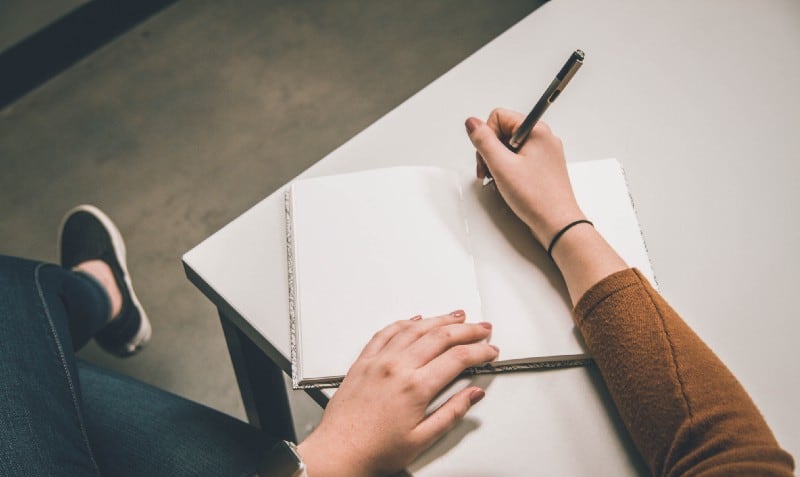 Writing in a notebook