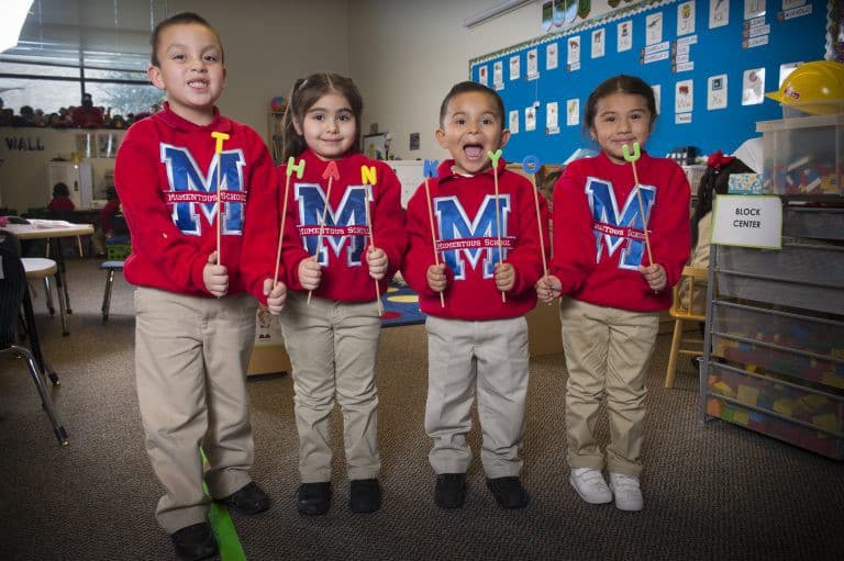 Kids holding letters spelling thank you
