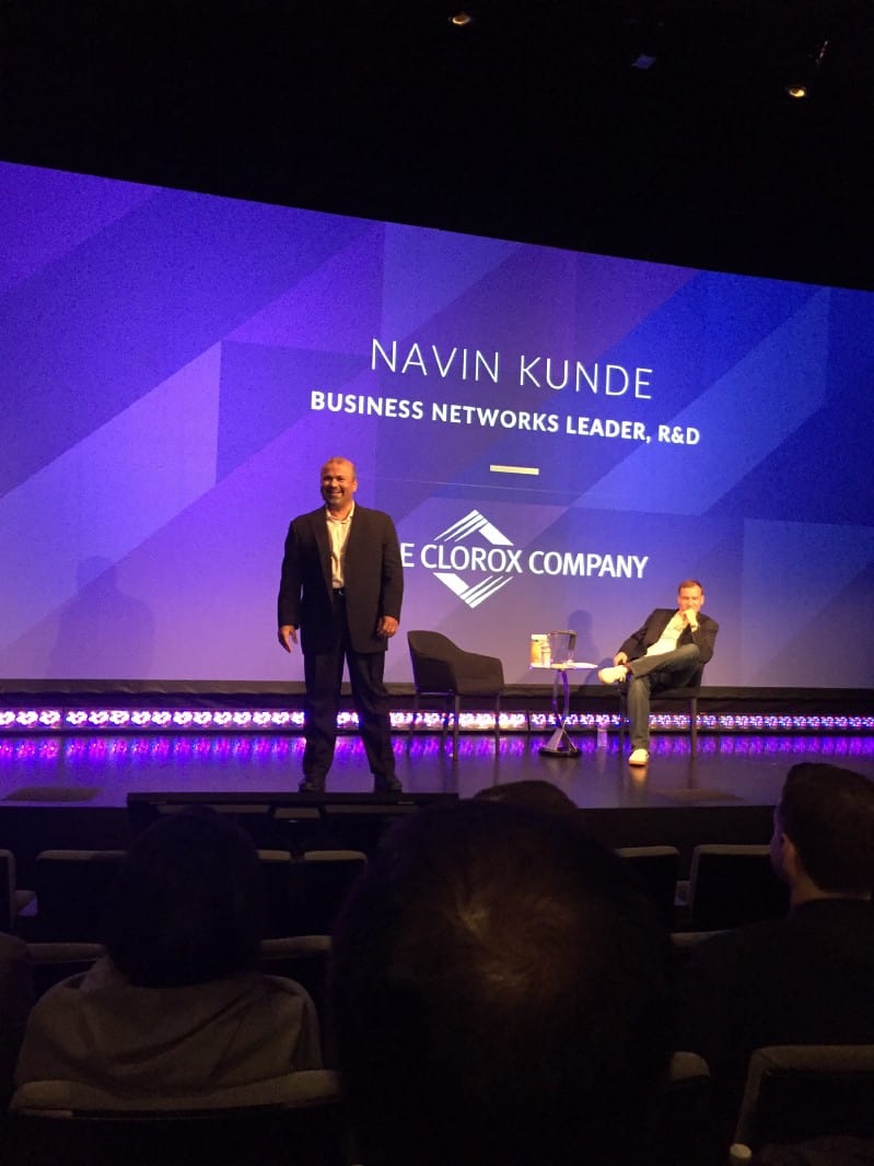 Navin Kunde speaking on stage