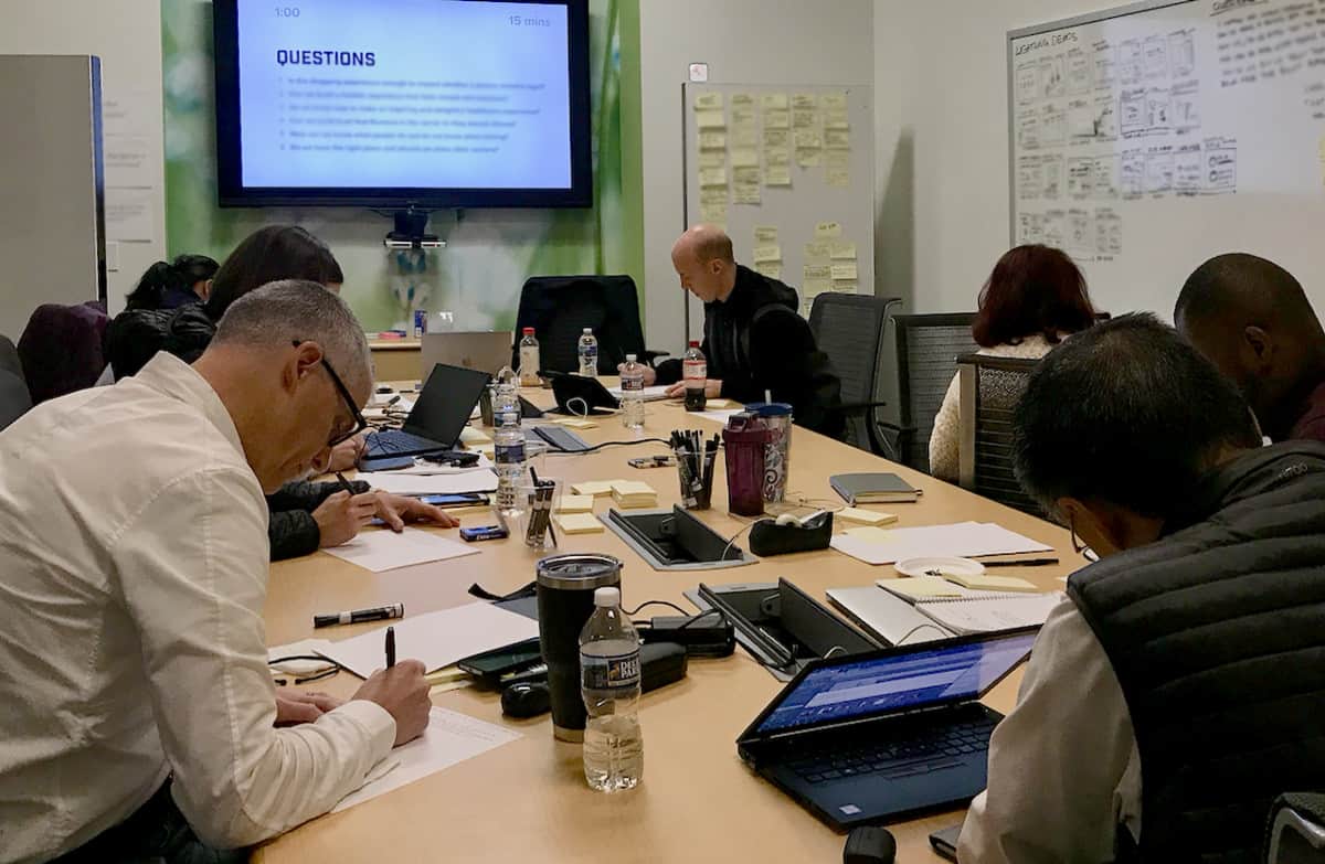 A team working individually while listening to the Comprehensive Voltage Controlled playlist on Spotify.