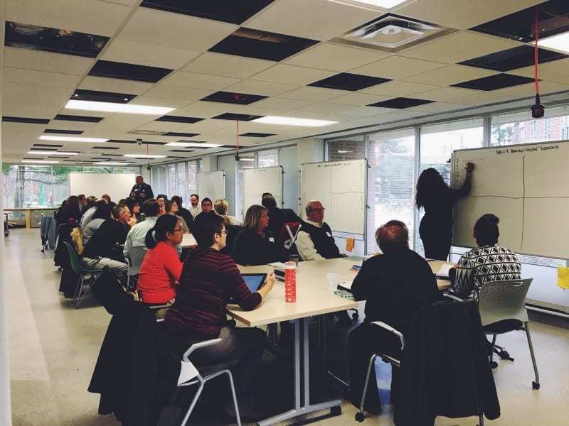 Faculty at a gathering at the Hub.