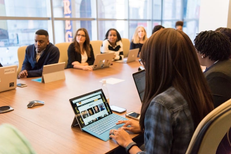 Employees working at table