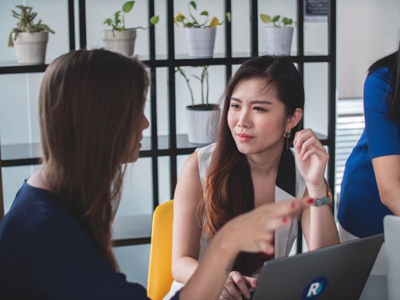 Two women discussing business