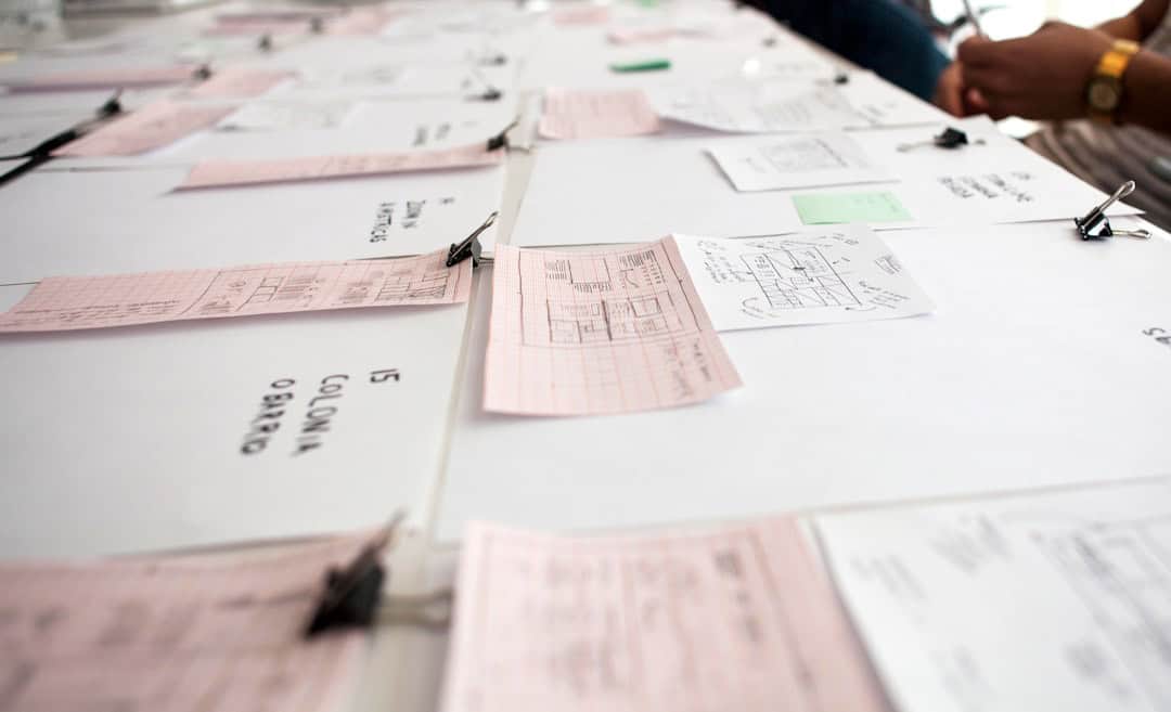 white printer paper on white table - facilitation certification worth it