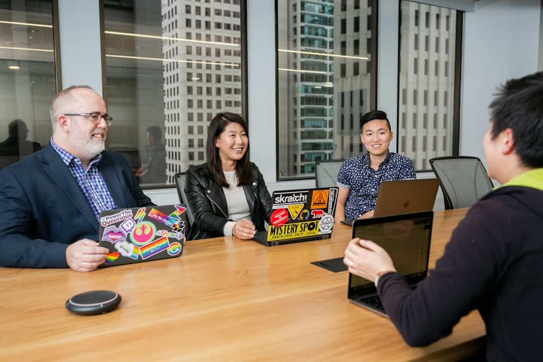 people in a design meeting in an office boardroom - executive buy-in ai initiatives