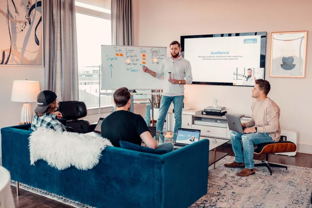 a man giving a presentation to a group of people - ai transformation roadmap