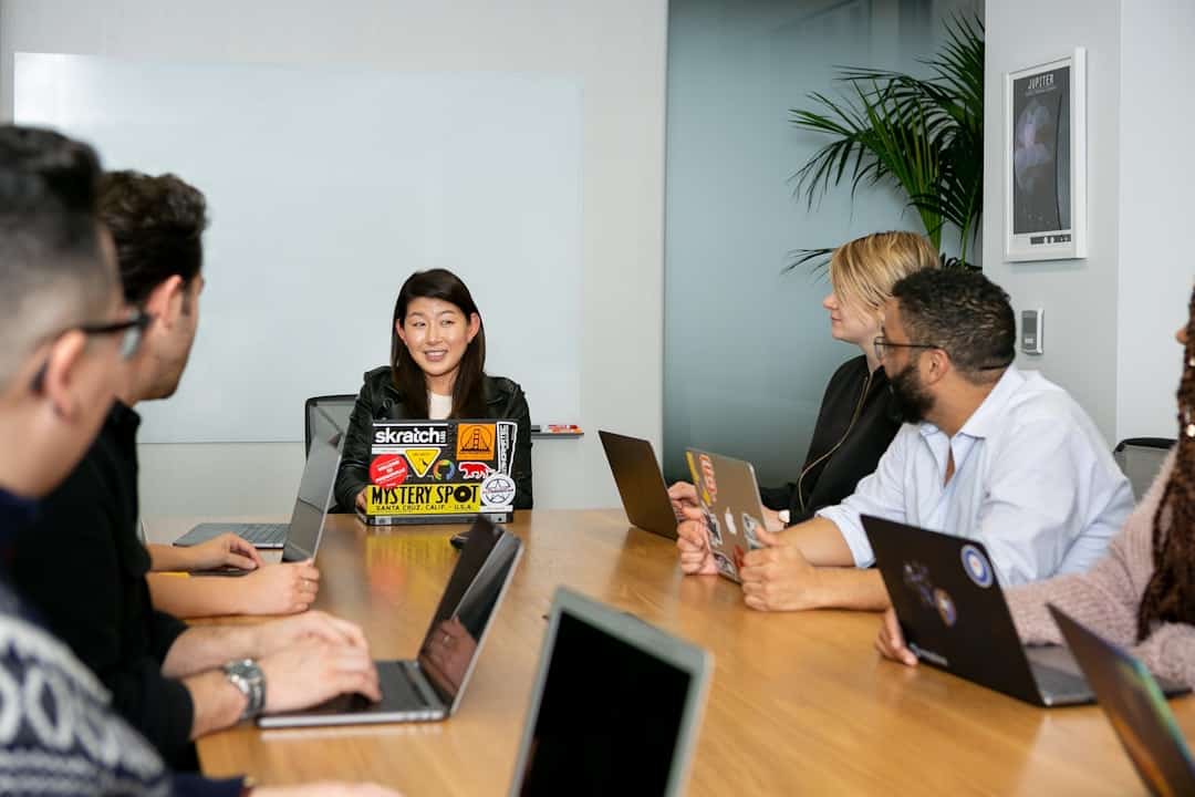 people in a meeting discussing app development - measure ai transformation success