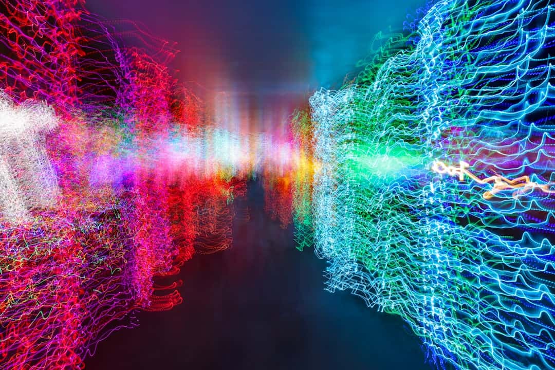 an abstract image of colorful lights in a dark room - applied generative ai for digital transformation