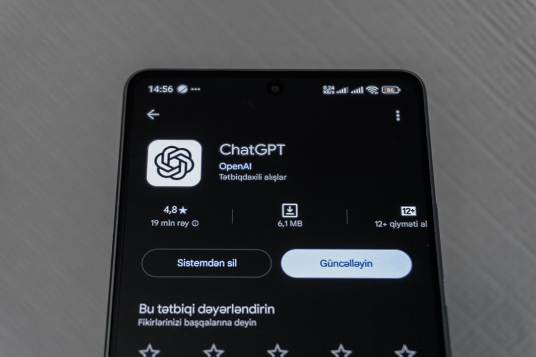 Smartphone screen displaying chatgpt app details. - ai for digital transformation