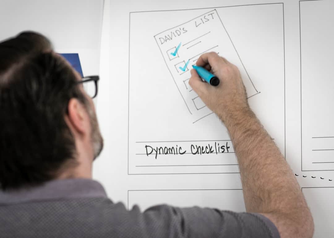 person writing on whiteboard - change management plan template
