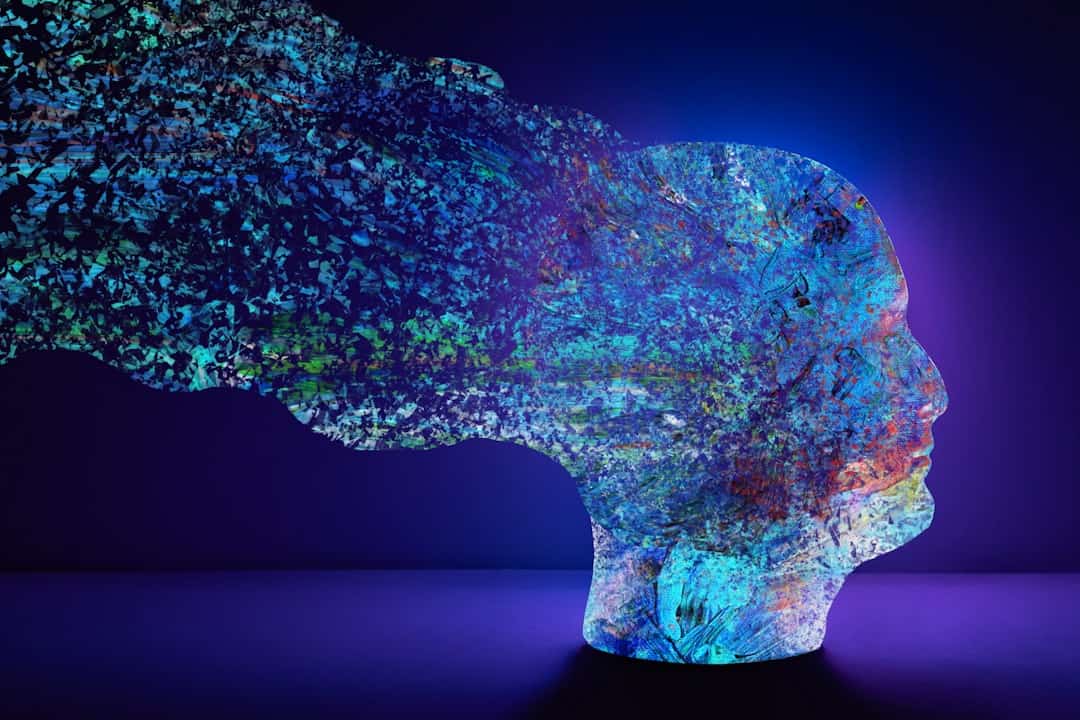 Abstract head with colorful nature elements dissolving - psychological safety ai adoption