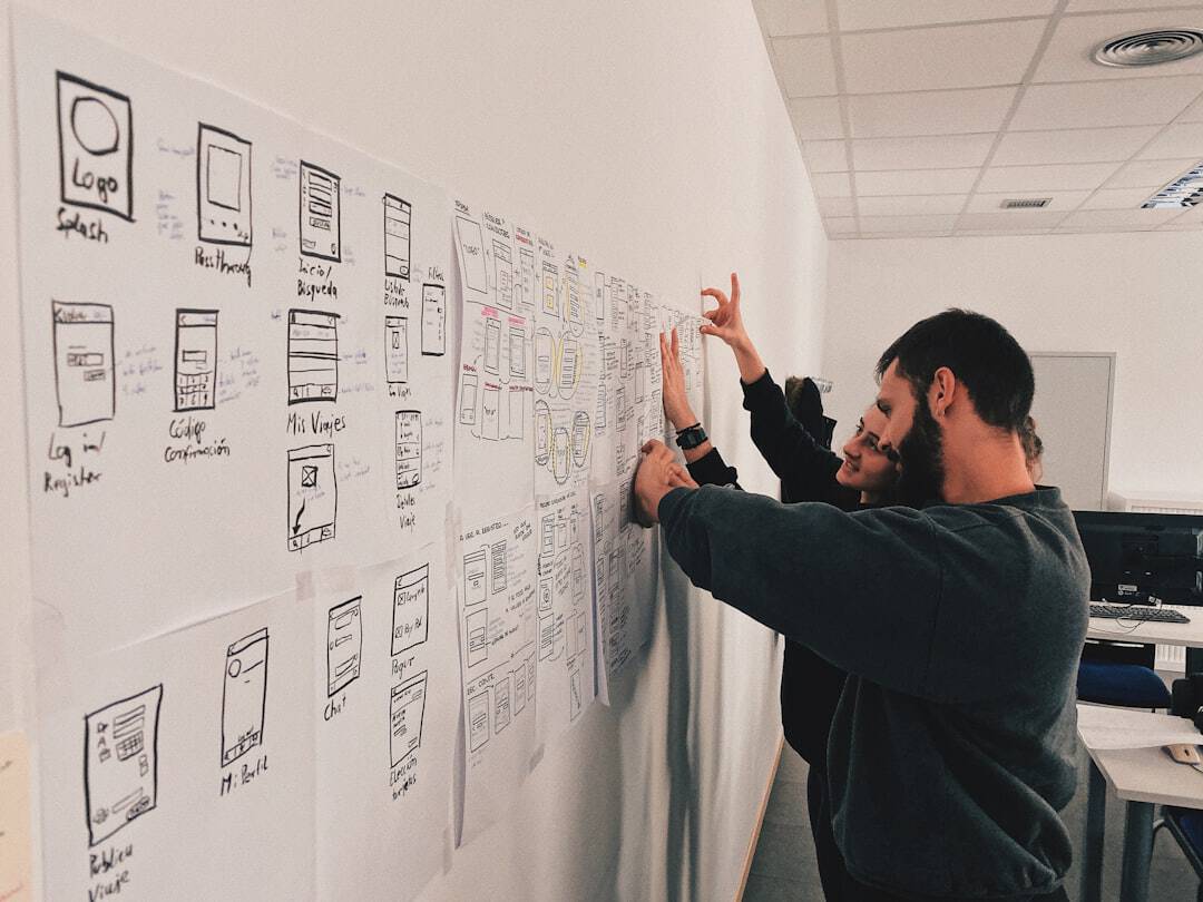 man in gray sweater standing beside wall - design thinking ai era